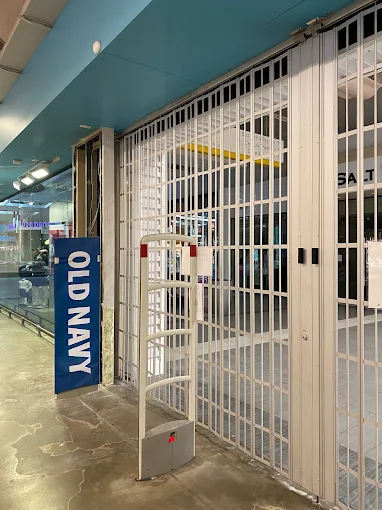 Retail storefront rolling security grille
